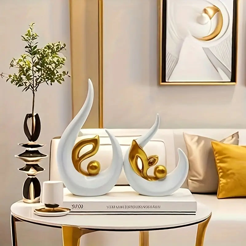 Lot de 2 sculptures élégantes en résine.